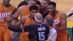 WATCH: Vince Carter earns ejection after dropping Devin Booker with vicious elbow